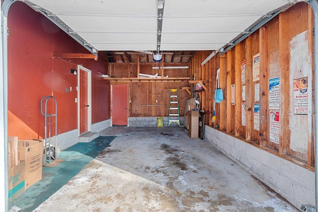 garage featuring wood walls