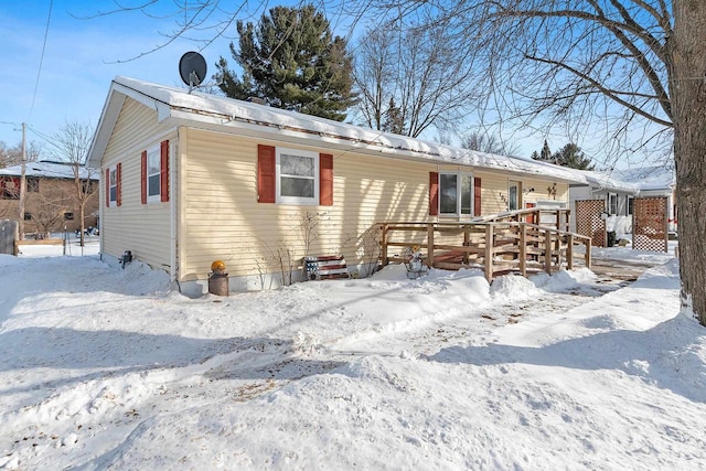 view of front of property featuring a wooden deck