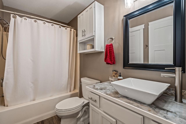 full bathroom featuring wood finished floors, vanity, toilet, and shower / bath combo with shower curtain