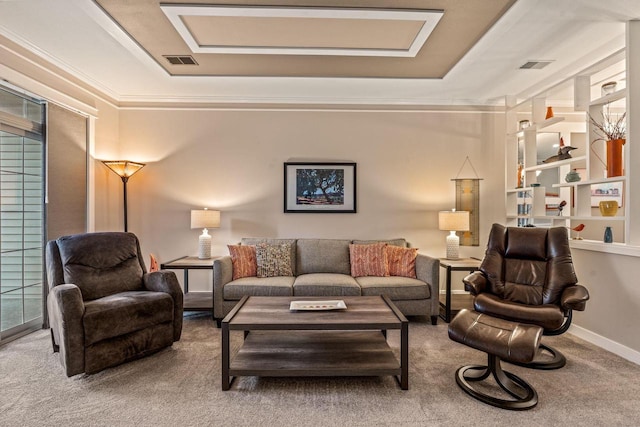 carpeted living room featuring baseboards, visible vents, a raised ceiling, and ornamental molding