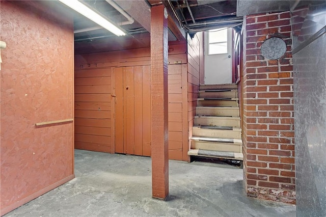 basement featuring stairs