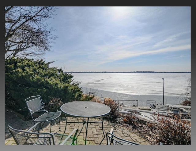 view of patio / terrace featuring a water view