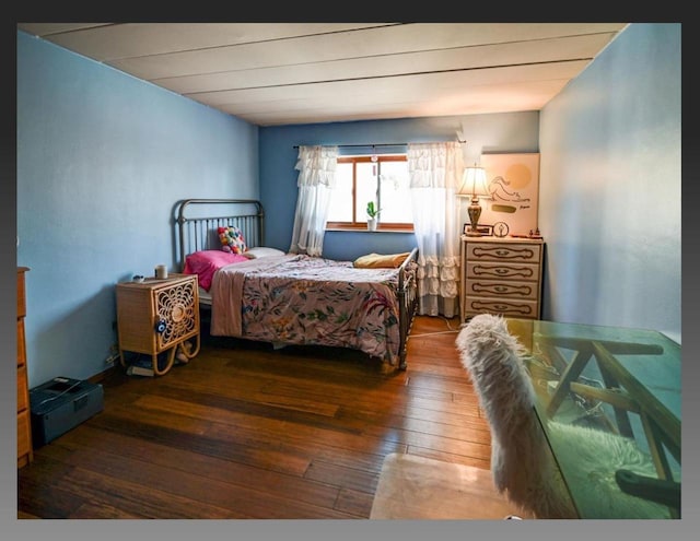 bedroom with hardwood / wood-style floors