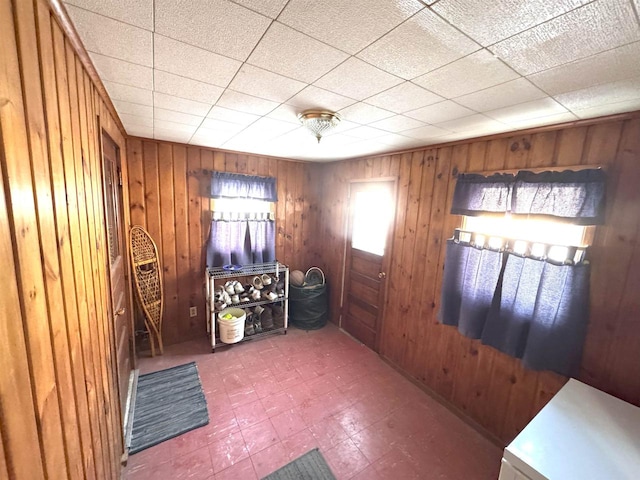 interior space featuring wood walls