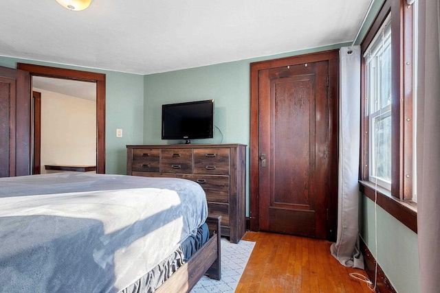 bedroom with light wood-type flooring