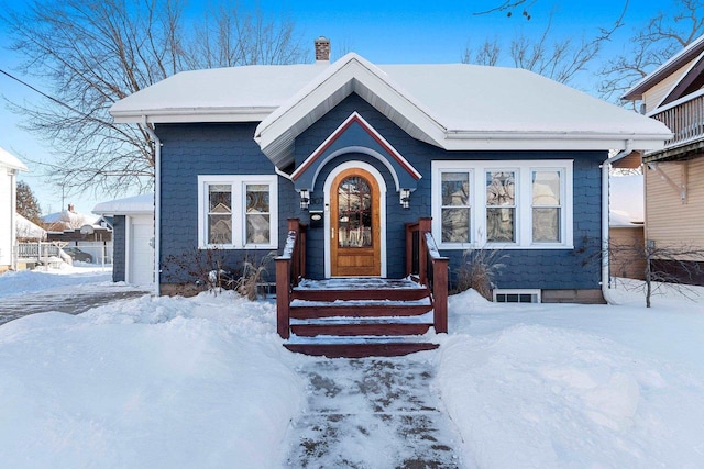 view of front of home featuring a chimney