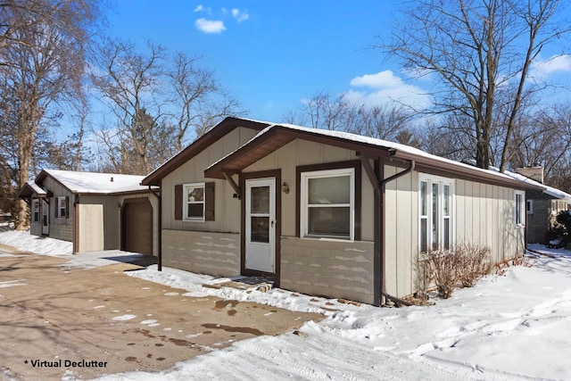 view of front of home with a garage and board and batten siding