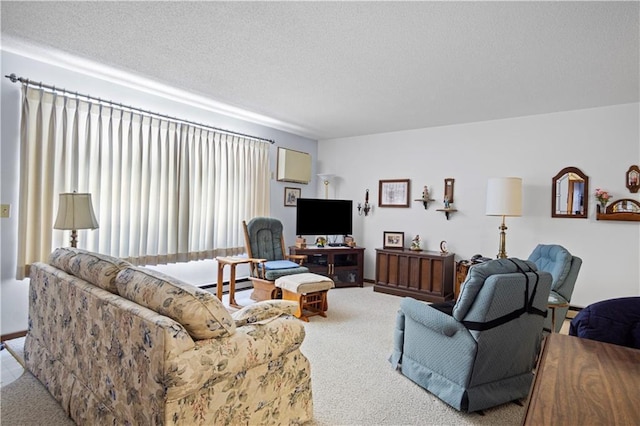 living room featuring a textured ceiling, baseboard heating, and light colored carpet