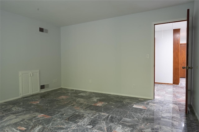 1725 Old Oak Ct, Brookfield, WI 53005 - spare room with marble finish floor, baseboards, and visible vents