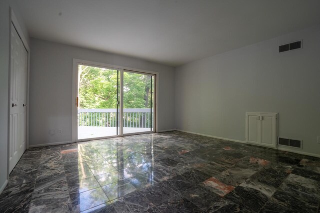 1725 Old Oak Ct, Brookfield, WI 53005 - empty room featuring marble finish floor, visible vents, and baseboards