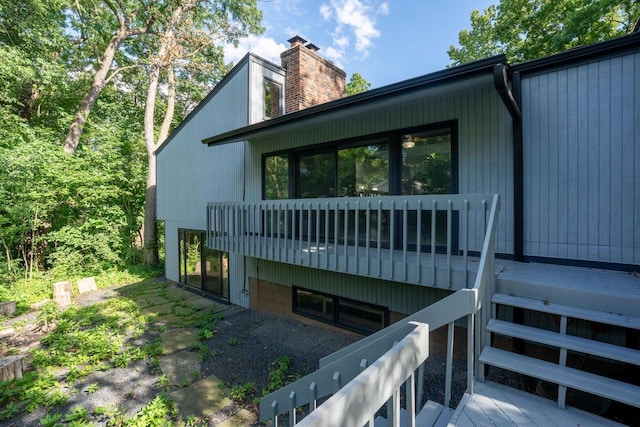 1725 Old Oak Ct, Brookfield, WI 53005 - view of property exterior featuring a chimney and a wooden deck