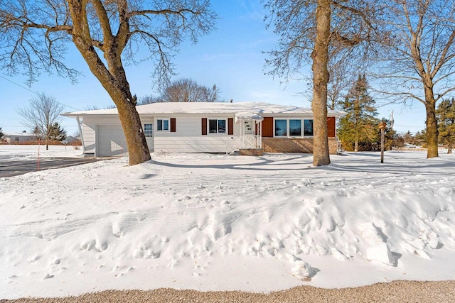 ranch-style home featuring an attached garage