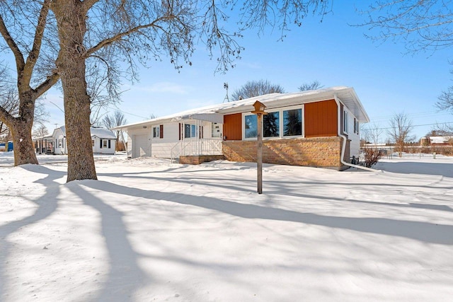 single story home with brick siding