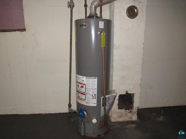 utility room featuring water heater