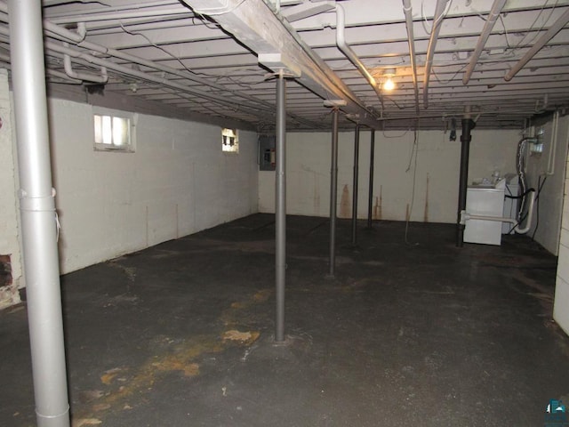 below grade area featuring washer / dryer and electric panel