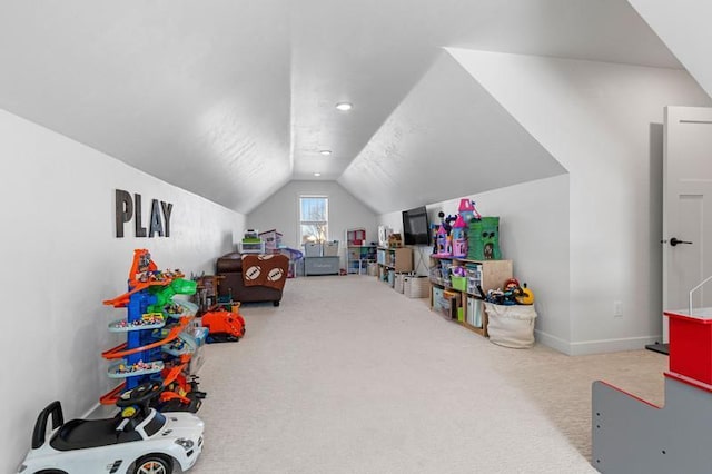 playroom with lofted ceiling, baseboards, and carpet