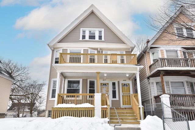 view of front of house featuring a porch and a balcony