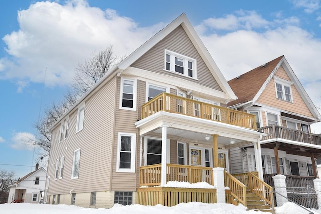 view of front of house with covered porch and a balcony