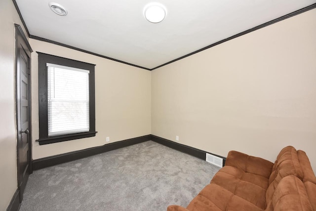 empty room featuring ornamental molding, visible vents, carpet floors, and baseboards