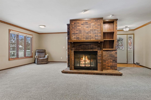 unfurnished living room with light carpet, visible vents, a fireplace, and ornamental molding