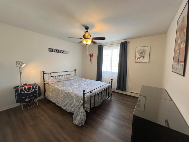 bedroom featuring dark wood-style floors and a ceiling fan