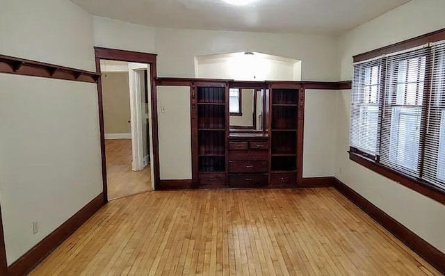 interior space with light wood-style flooring and baseboards