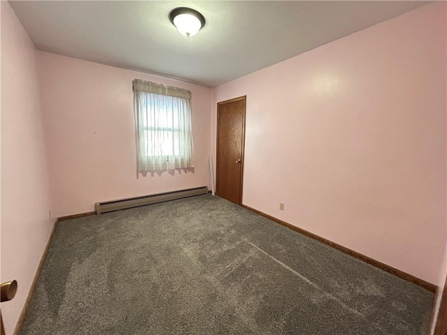 carpeted empty room featuring a baseboard radiator and baseboards