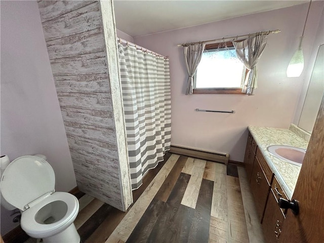 bathroom featuring toilet, a shower with curtain, wood finished floors, vanity, and a baseboard heating unit