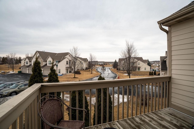 wooden terrace with a residential view