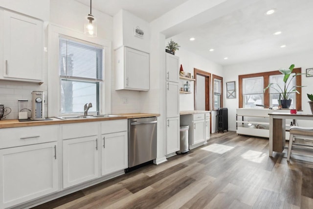 kitchen with wood counters, white cabinetry, dishwasher, open shelves, and decorative light fixtures