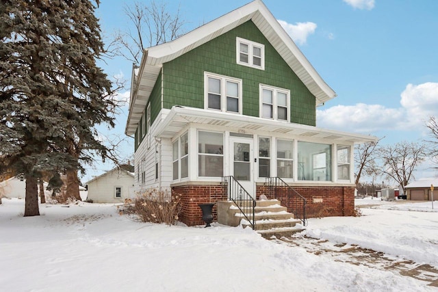 traditional style home with brick siding