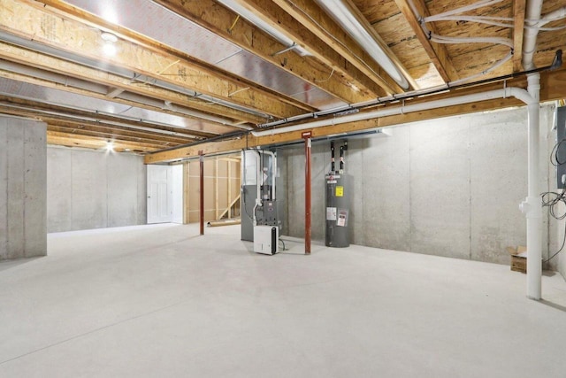 unfinished basement featuring heating unit and water heater