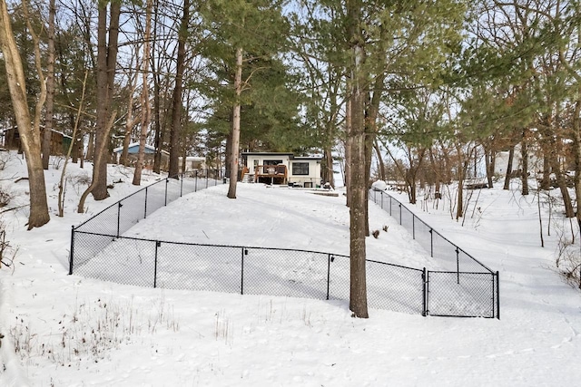 snowy yard with fence