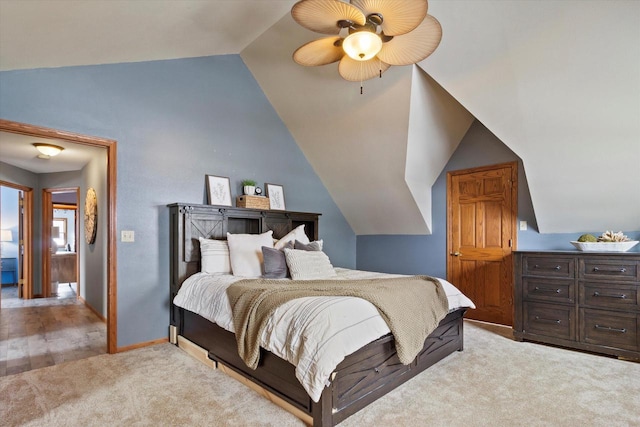 bedroom with light carpet, baseboards, a ceiling fan, and lofted ceiling