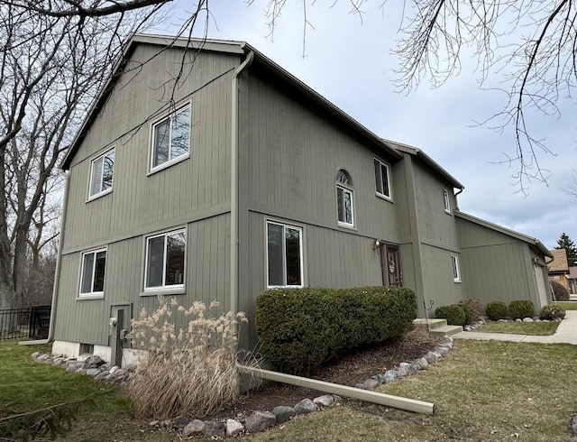 view of side of property featuring a yard