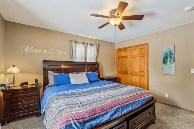 bedroom with baseboards, a closet, carpet floors, and ceiling fan