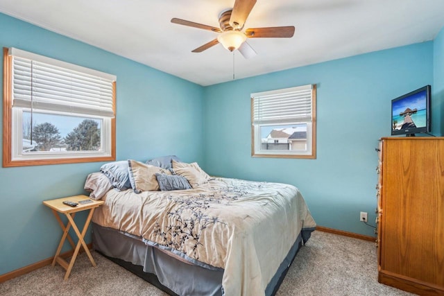 bedroom with carpet flooring, a ceiling fan, and baseboards