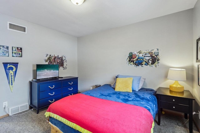 carpeted bedroom featuring visible vents