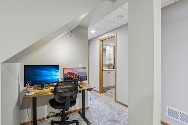 office space featuring a drop ceiling, visible vents, carpet floors, and baseboards