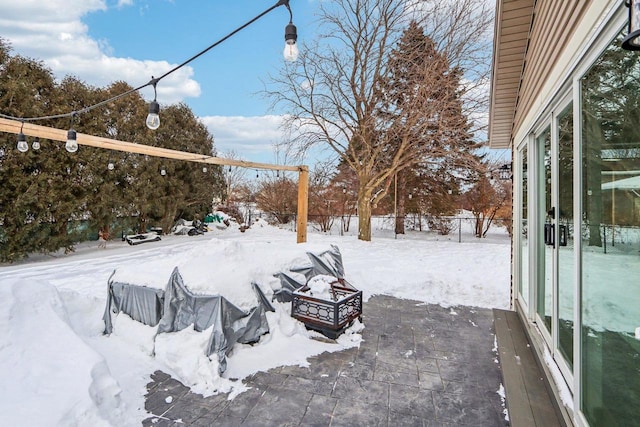 snowy yard with fence