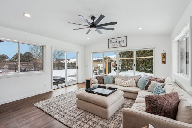 living room with baseboards, vaulted ceiling, recessed lighting, wood finished floors, and a ceiling fan