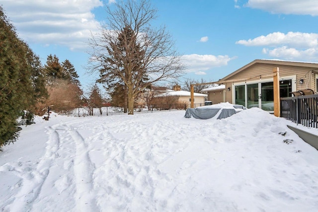 view of yard covered in snow