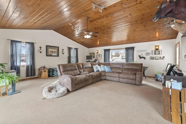 living area with plenty of natural light, wood ceiling, light colored carpet, and vaulted ceiling