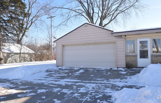 view of snow covered garage