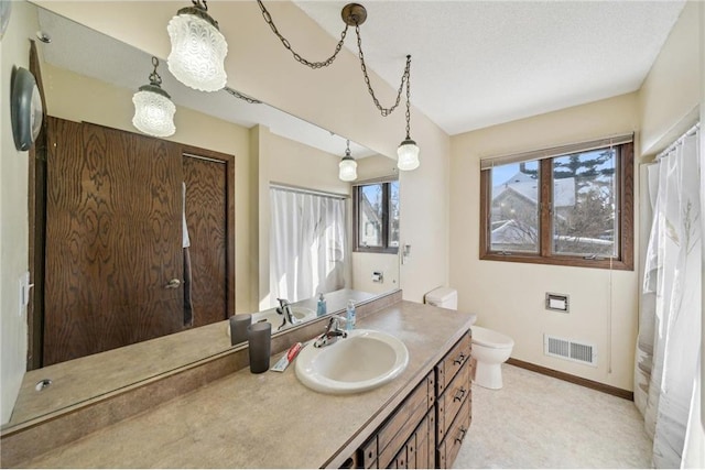 bathroom with toilet, baseboards, visible vents, and vanity