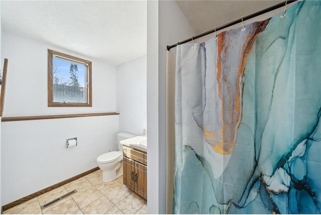 full bathroom featuring visible vents, toilet, a textured ceiling, vanity, and tile patterned floors