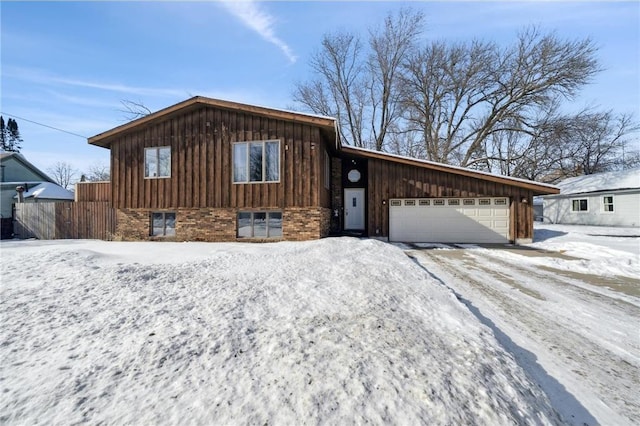 view of front of house featuring brick siding and an attached garage