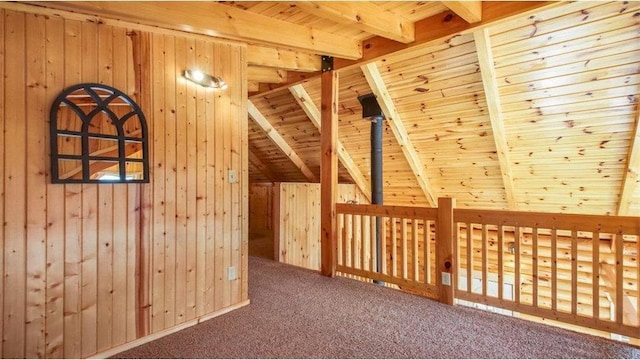 bonus room with wooden walls, carpet, wooden ceiling, and vaulted ceiling with beams