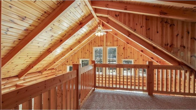 additional living space with wooden walls, wooden ceiling, vaulted ceiling with beams, and carpet