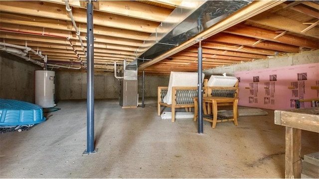 unfinished basement with heating unit and water heater